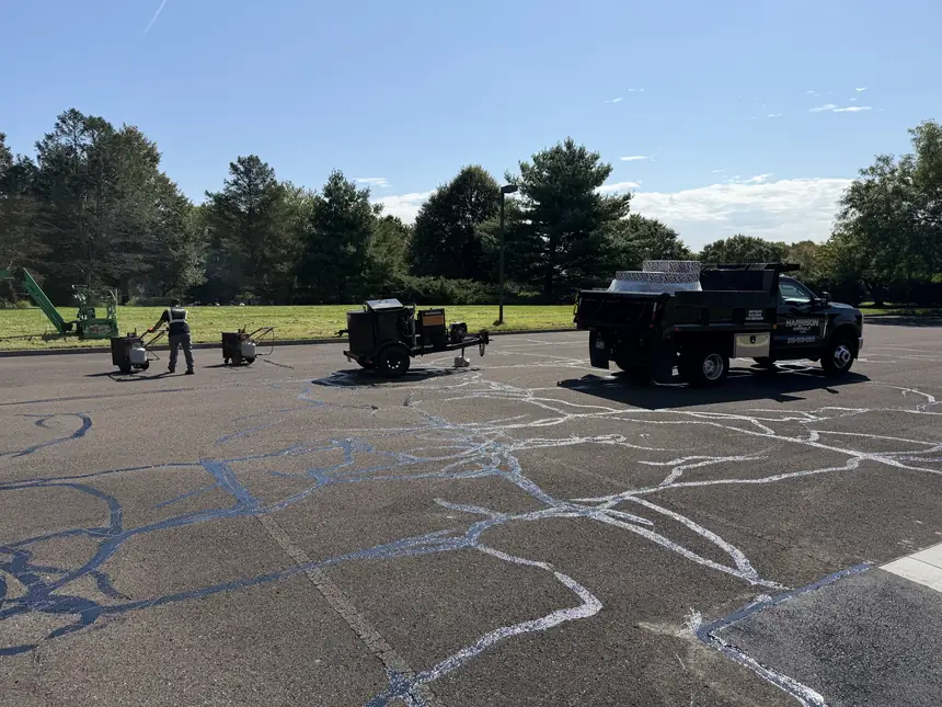 Crack sealing across a large commercial lot