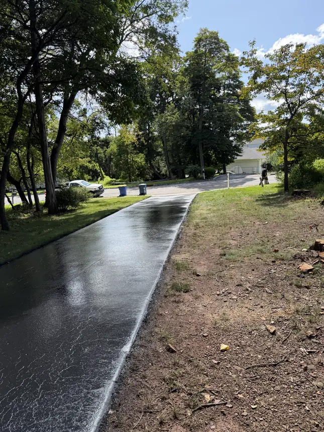 Freshly sealed driveway by Harrison Asphalt